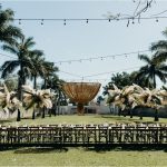 long wooden table outside at wedding venue in Mexico Hacienda Sac Chich