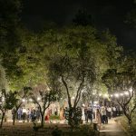 wedding guests in gardens in the evening at historical private villa wedding venue in Sorrento Italy villa zagara