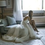 bride getting dressed at luxury wedding venue in Tuscany COMO Castello Del Nero
