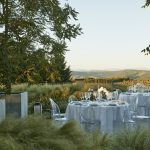 wedding reception tables set up outside at luxury wedding venue in Tuscany COMO Castello Del Nero