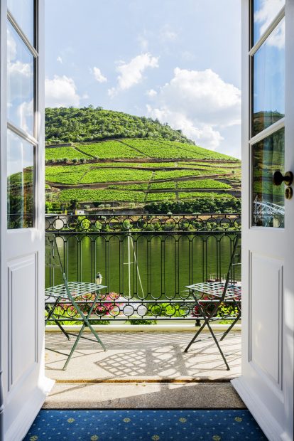 balcony overlooking Douro river at the vintage house hotel at portugal wedding venue Douro valley