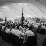 black and white image of wedding guests dining at wedding venue in france provence le domaine du rey