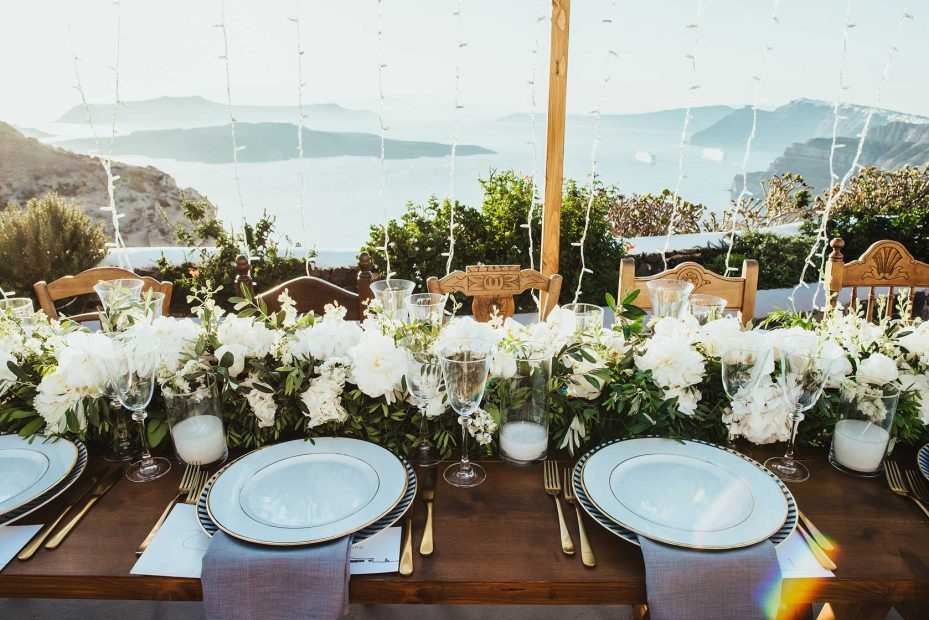 wedding breakfast table set up at wedding venue in Santorini venetsanos winery