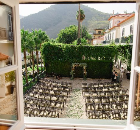 view out the windows over the ceremony set up outside at Douro valley wedding venue the vintage house hotel in portugal