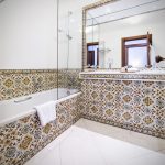 the vintage house hotel bathroom with traditional Portuguese tiles the vintage house hotel at portugal wedding venue in Douro valley
