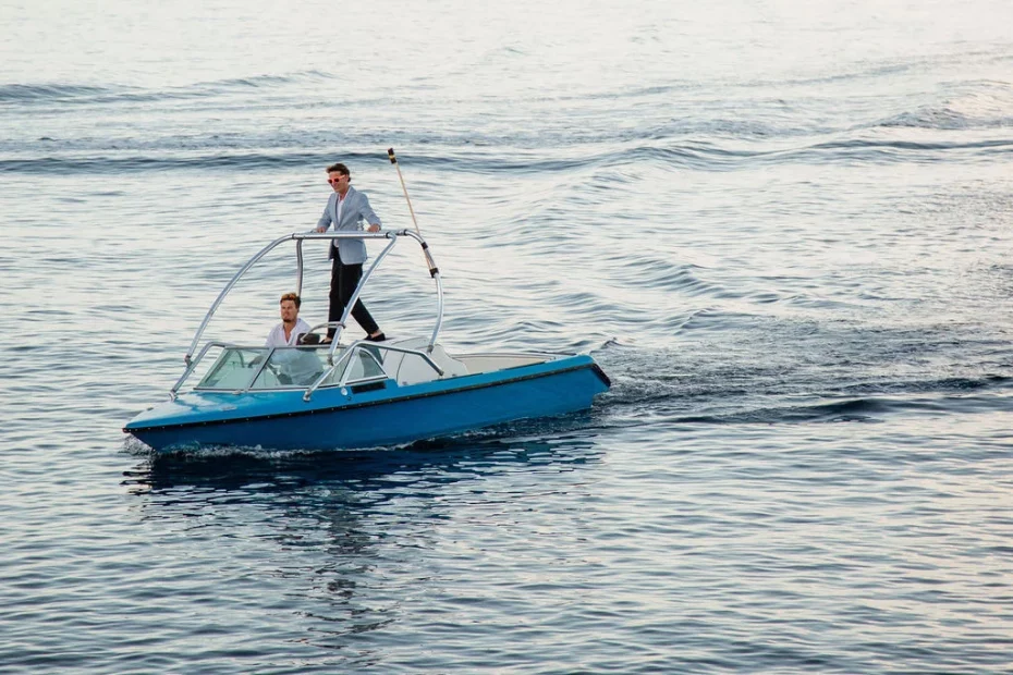 Image of groom arriving by boat at wedding venue The Peligoni Club