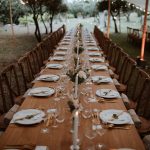 wooden tables under marquee at wedding venue in france provence