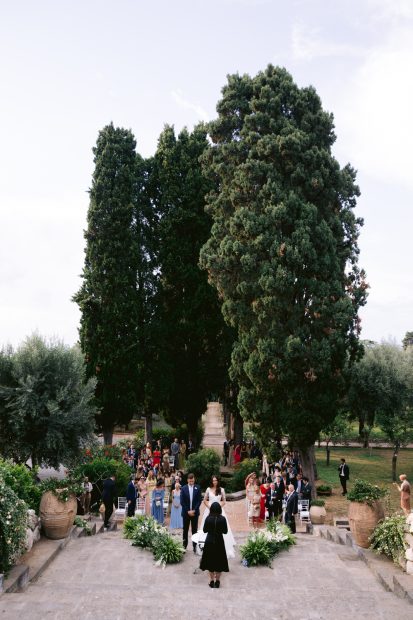 wedding ceremony outside on the grounds at historical private villa wedding venue in Sorrento Italy villa zagara