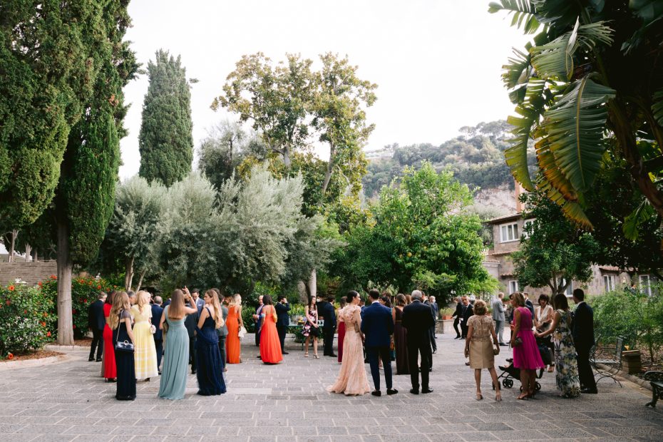wedding guests mingling before the ceremony at historical private villa wedding venue in Sorrento Italy villa zagara