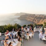 guests seated for wedding breakfast at wedding venue in Santorini venetsanos winery