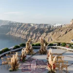 stunning wedding ceremony set up at wedding venue in Santorini venetsanos winery