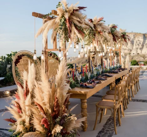 close up section of wedding tables for boho wedding at wedding venue in Santorini venetsanos winery