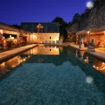 pool aea at night at chateau wedding venue in france chateau de vallery