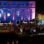 night time light display against the chateau at chateau wedding venue in france chateau de vallery