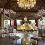wedding tables and chandeliers at chateau wedding venue in france chateau de vallery