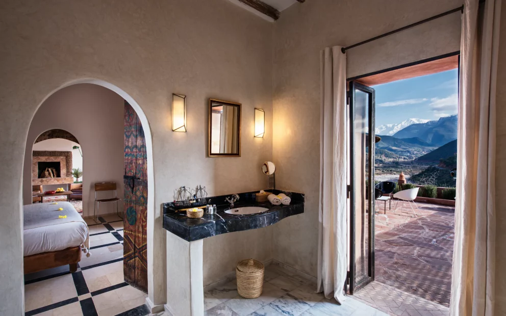en suite with balcony and view of atlas mountains at unique wedding venue in morocco kasbah bab ourika
