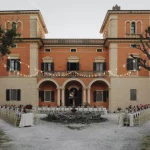 view of the front of villa lena at wedding venue in tuscany villa lena