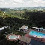 drone shot above villa lena pool and grounds