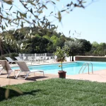 pool with loungers at wedding venue in tuscany villa lena