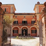 red exterior at wedding venue in tuscany villa lena
