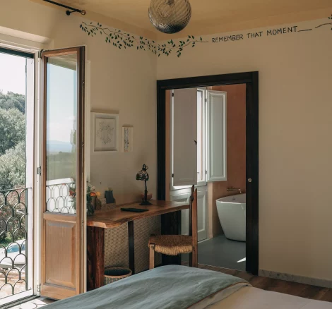bedroom with Juliette balcony at wedding venue in tuscany villa lena