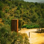 cool rusted sign at the end of the driveway up to vineyard wedding venue in Barcelona Spain Masia cabellut
