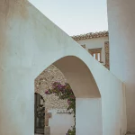 stone arched entryway outside the best private vineyard wedding venue in Barcelona Spain Masia Cabellut