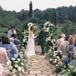 Couple at end of aisle at wedding venue Masia Cabellut, Spain