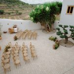 Wedding Ceremony with wooden chairs and a bonsai tree alter at Vineyard Wedding Venue Barcelona Masia Cabellut
