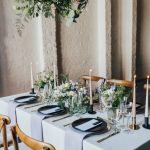 A unique blank canvas wedding venue in London, 100 Barrington wedding table decorated with neutral linens and foliage