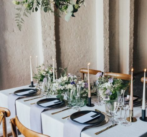 A unique blank canvas wedding venue in London, 100 Barrington wedding table decorated with neutral linens and foliage