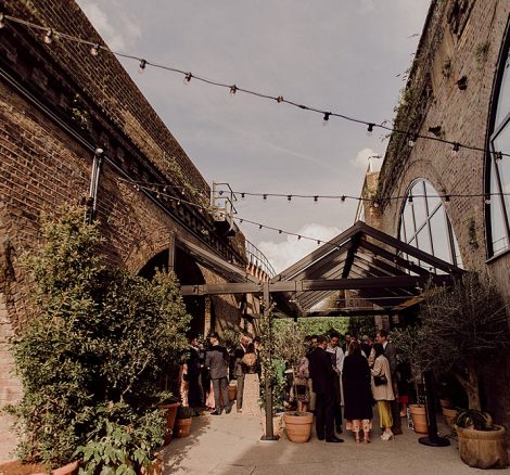 Festoon lighting over the courtyard at 100 Barrington, a unique wedding venue in south London