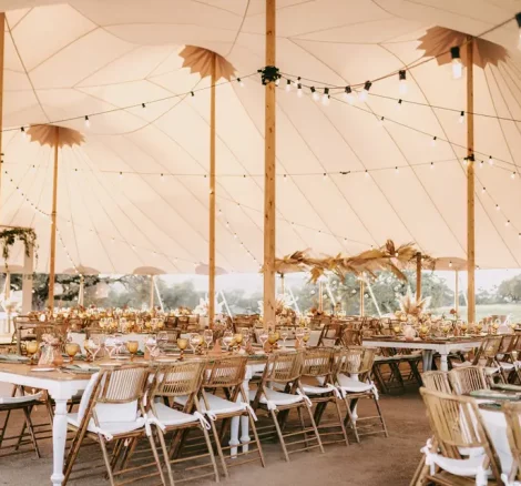 Al fresco wedding reception with long tables and string lights at Andalusian estate venue