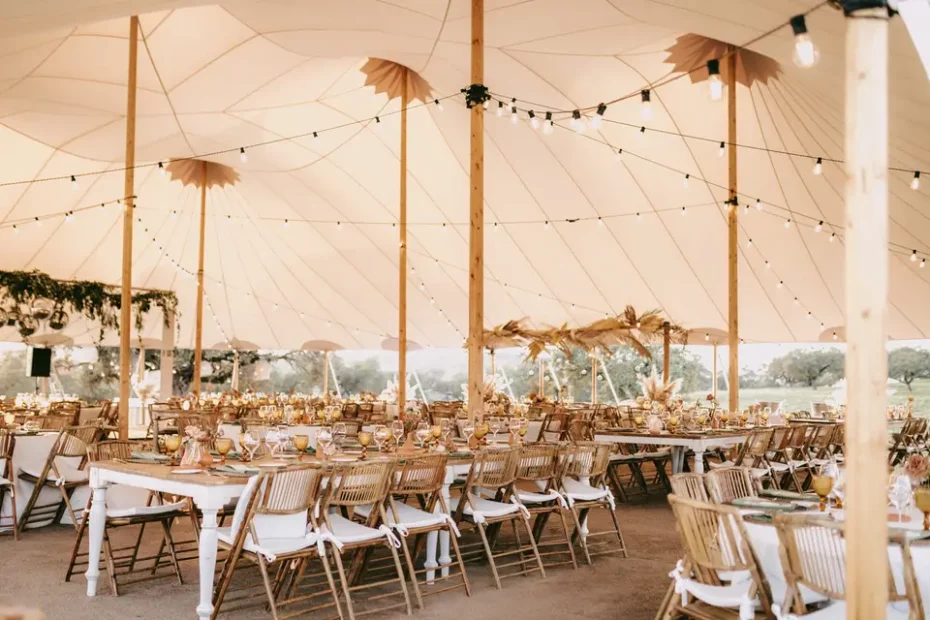 Al fresco wedding reception with long tables and string lights at Andalusian estate venue