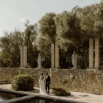 Married couple walking around the pool at wedding venue Finca Son Collell