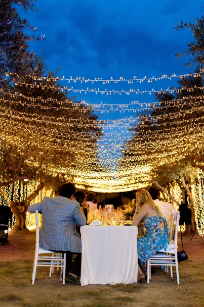 Image of lights hanging over seating at wedding venue Arbora Olea Luxury Resorts, Greece