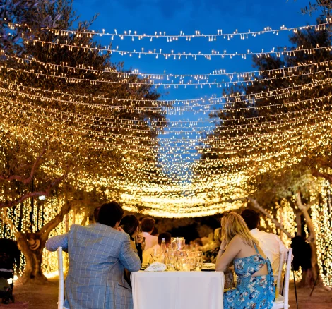 Image of lights hanging over seating at wedding venue Arbora Olea Luxury Resorts, Greece
