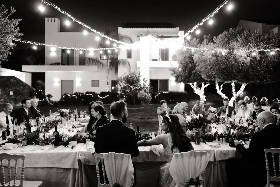 Image of couple sat at dining tables at wedding venue Arbora Olea Luxury Resorts, Greece