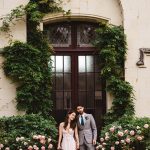Couple stood in front of door at wedding venue Chateau Challain