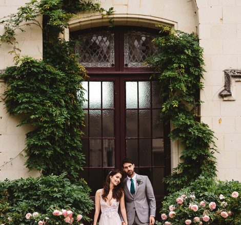 Couple stood in front of door at wedding venue Chateau Challain