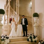 Image of couple walking down staurcase at wedding venue Chateau Challain