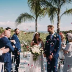 Image of couple walking down aisle which confetti at wedding venue Arbora Olea