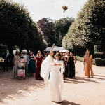Image of bride throwing her bouquet