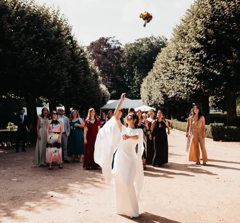 Image of bride throwing her bouquet