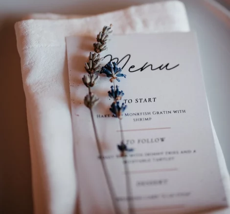 Image of menu on plate with lavender at wedding Venue Quinta do Jordão