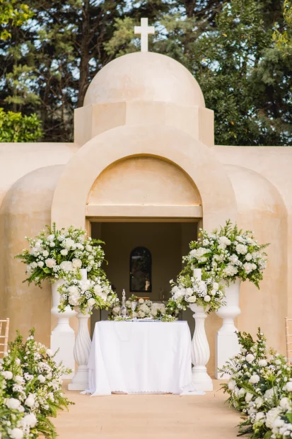 Image of chapel with white flowers at wedding venue Ktima Orizontes, Athens, Greece