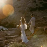 Image of married couple walking along the beach at wedding venue Elixir Ibiza