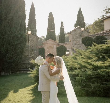Just married couple on the lawn at San Pietro sopra le Acque wedding venue in Umbria, Italy