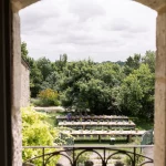 Image of tables taken on a balcony at wedding venue Chateau de Puissentut, France