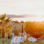 Image of tables in garden at wedding venue Villa Aphea, Greece